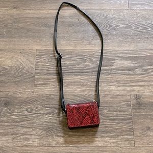 A small red Wild Fable purse.